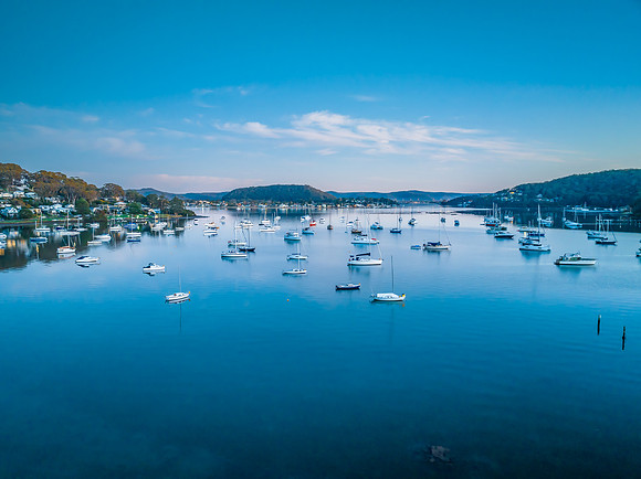 Sunrise blues with boats on the bay