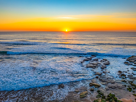 Sunrise at the Seaside with an Orange Horizon