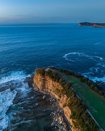Sunrise over the blue sea and rocky Inlet