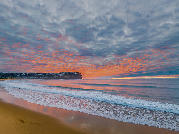 Stratus cloud filled sunrise over the ocean