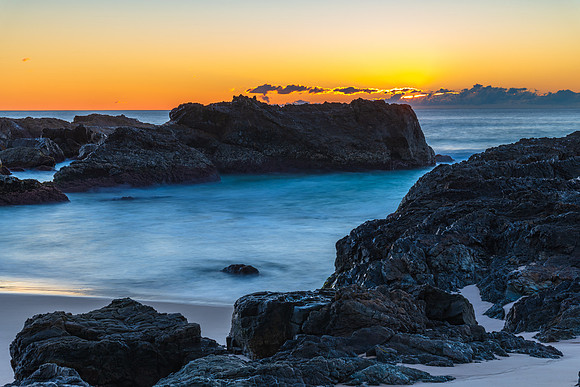 Sunrise seascape and a rocky beach