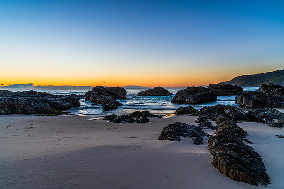 Sunrise seascape and a rocky beach