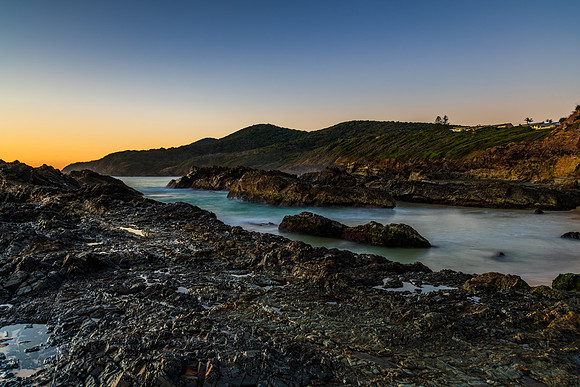 Sunrise seascape and a rocky beach