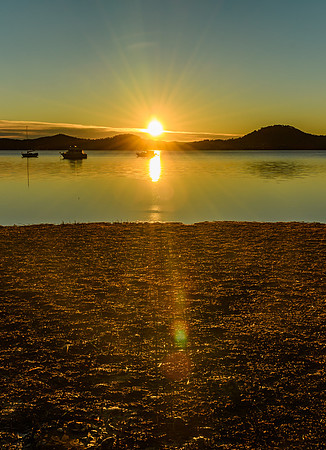 Daybreak waterscape over the bay with boats