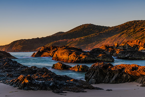 Sunrise seascape and a rocky beach