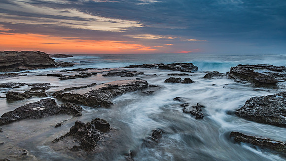 Sunrise Seascape and Rocky Headland