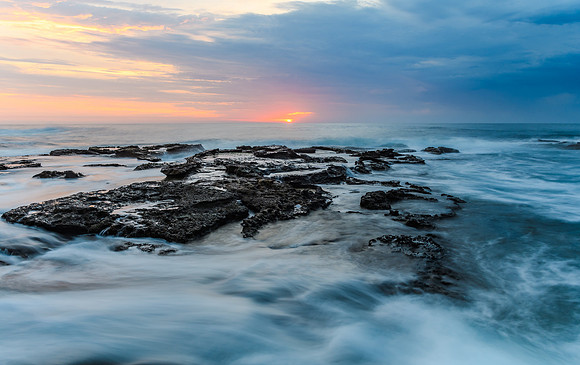 Sunrise Seascape and Rocky Headland