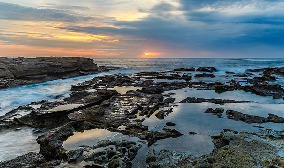 Sunrise Seascape and Rocky Headland