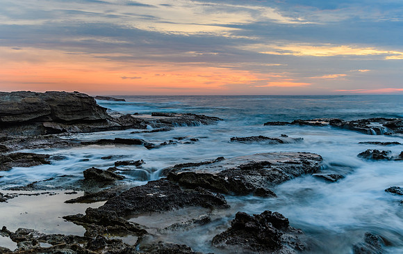 Sunrise Seascape and Rocky Headland