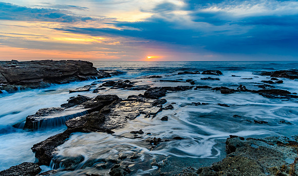 Sunrise Seascape and Rocky Headland