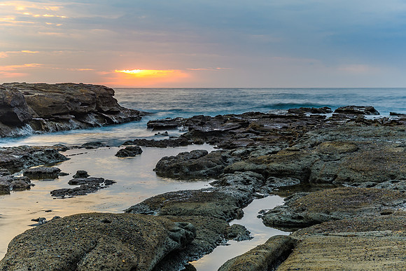 Sunrise Seascape and Rocky Headland