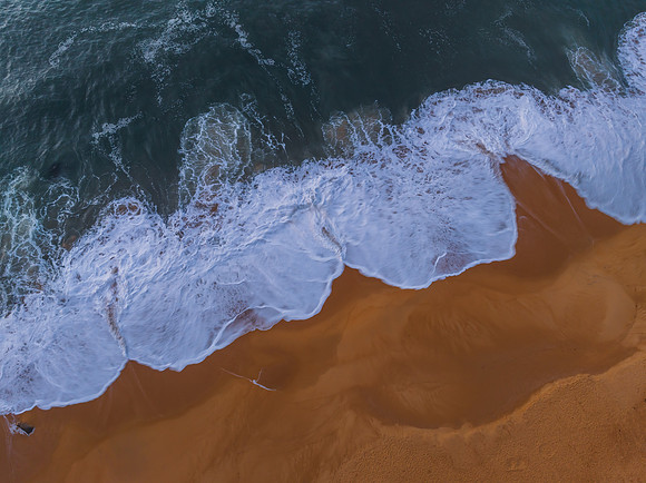 Top down sea and rocks in the very early morning light