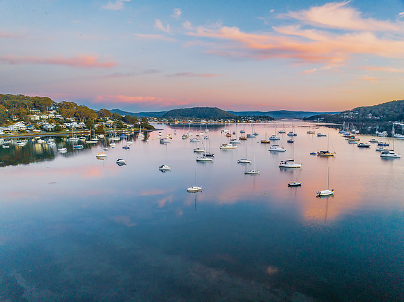 Sunrise blues with boats on the bay