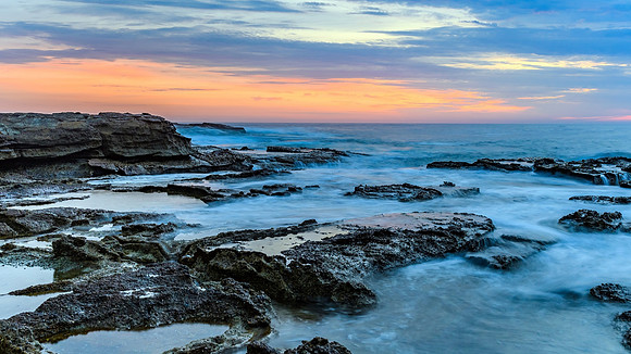 Sunrise Seascape and Rocky Headland