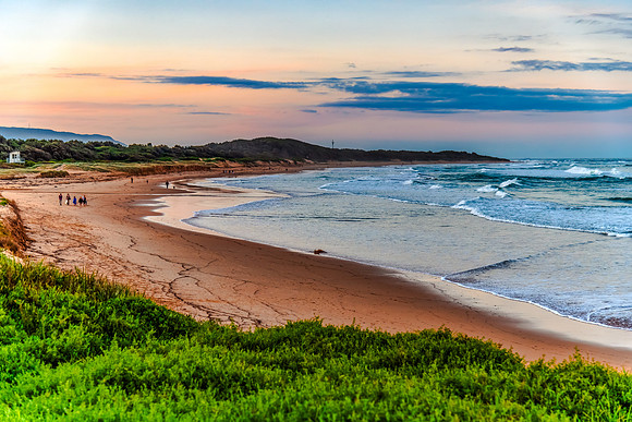 Sunset at the Seaside with black rocks