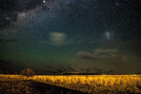 The night sky with some light cloud over the countryside