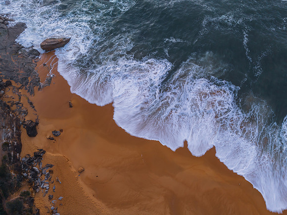 Top down sea and rocks in the very early morning light