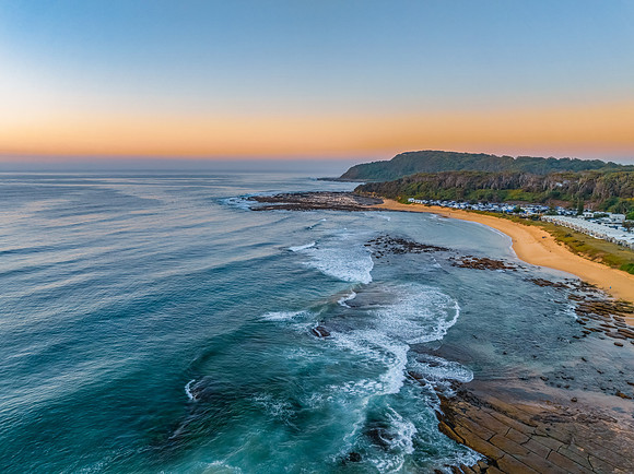 Aerial sunrise at the beach with clear skies