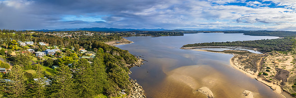 A cloud covered winters morning where the river meets the sea in