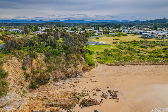 A cloud covered winters day at the beach in Tomakin