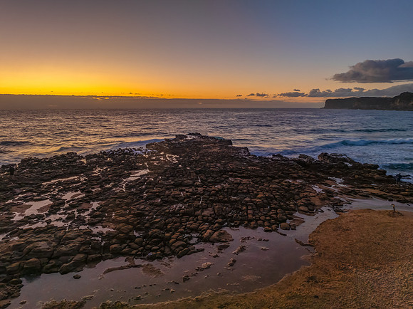 Sunrise over the sea and rock platform