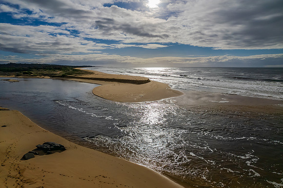 A cloud covered winters morning where the river meets the sea in