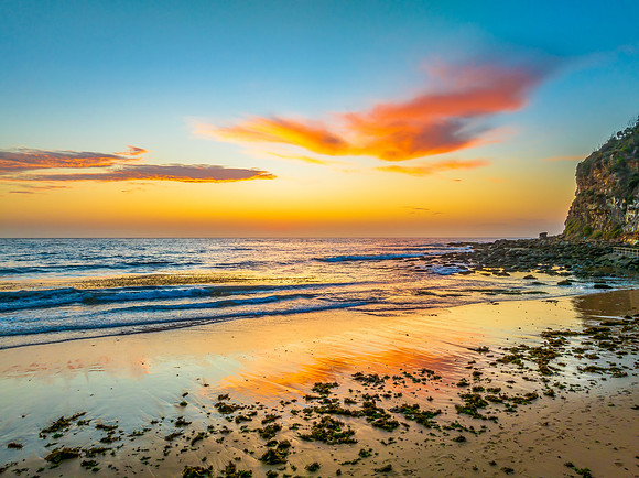 Sunrise at the seashore with clouds