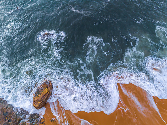Top down sea and rocks in the very early morning light