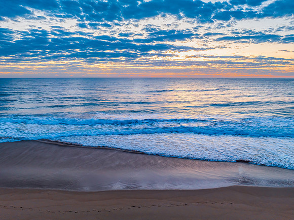 Sunrise at the seaside with clouds