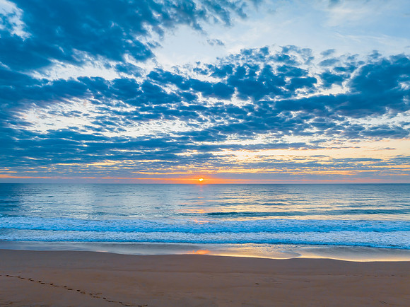 Sunrise at the seaside with clouds