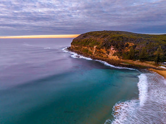 Stratus cloud filled sunrise over the ocean