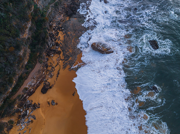 Top down sea and rocks in the very early morning light