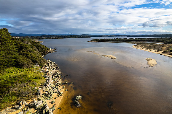A cloud covered winters morning where the river meets the sea in