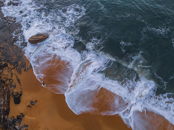 Top down sea and rocks in the very early morning light
