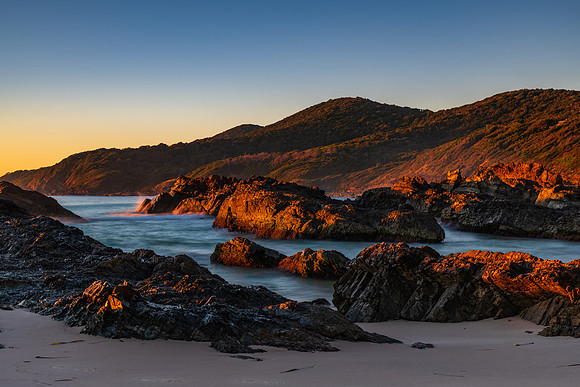 Sunrise seascape and a rocky beach