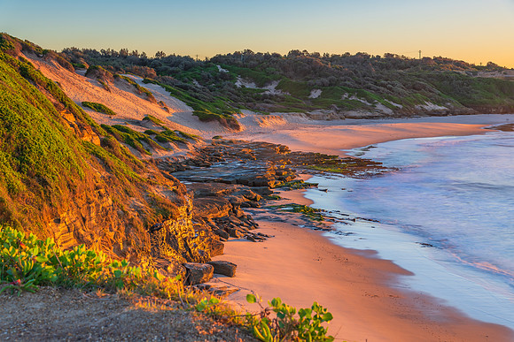 Sunrise seascape with rock platform