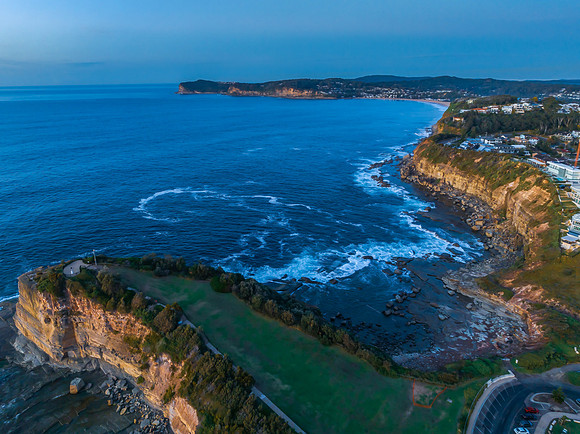 Sunrise over the blue sea and rocky Inlet