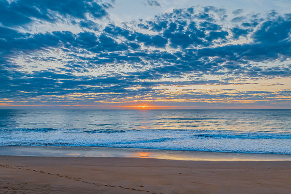 Sunrise at the seaside with clouds