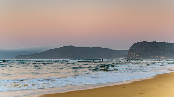 Hazy Reverse Sunrise Seascape with Paddleboarders