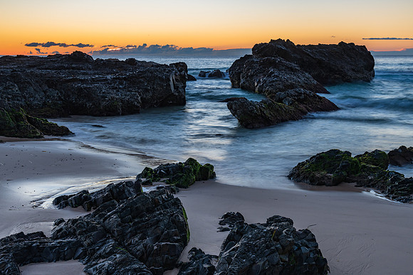 Sunrise seascape and a rocky beach
