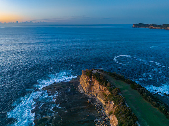 Sunrise over the blue sea and rocky Inlet