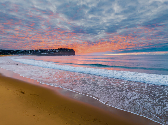 Stratus cloud filled sunrise over the ocean