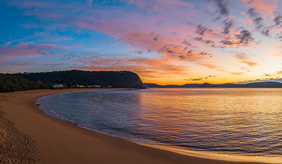 Aerial sunrise seascape with pretty cloud filled sky