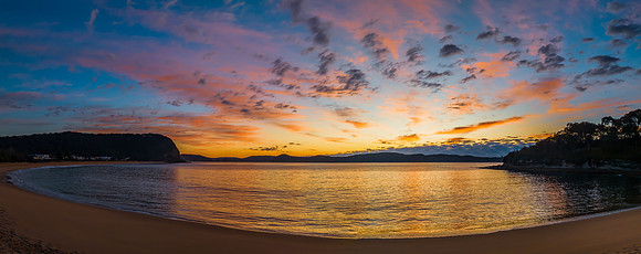 Aerial sunrise seascape with pretty cloud filled sky