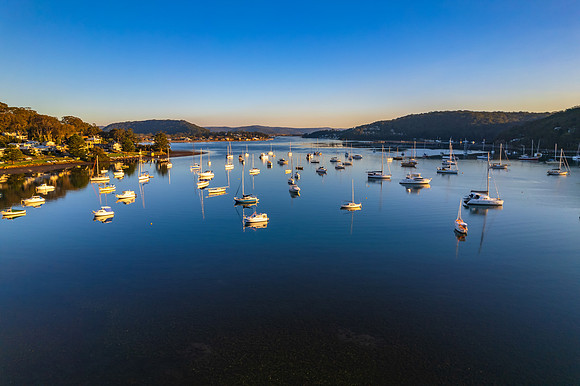 Early morning aerial waterscape with boats