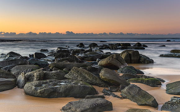 Rocky Shoreline and Sunrise