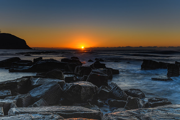 Sunrise and the Rocky Sea