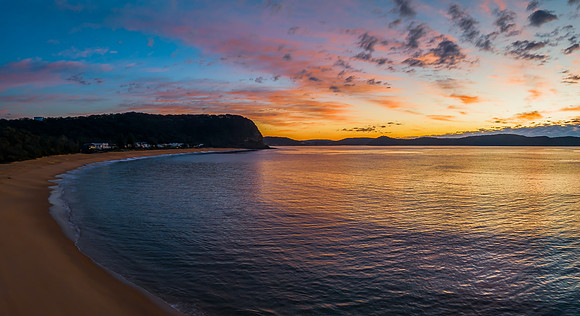 Aerial sunrise seascape with pretty cloud filled sky