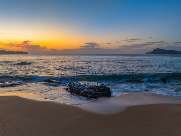 Aerial sunrise at the seaside with light scattered high cloud an