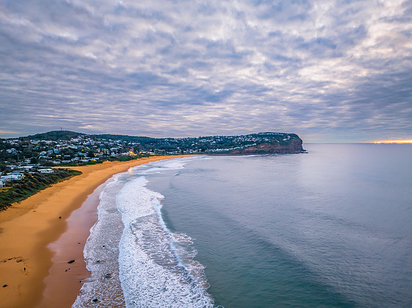 Stratus cloud filled sunrise over the ocean